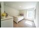 Cozy bedroom featuring a comfortable bed, bright window, and a stylish white dresser at 619 Red Mulberry Rd, Moncks Corner, SC 29461