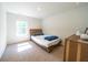 Bedroom with a modern bed frame, dresser, and bright natural light from the window at 619 Red Mulberry Rd, Moncks Corner, SC 29461
