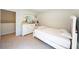 Inviting bedroom with a white bed, dresser with mirror, and soft carpeting at 619 Red Mulberry Rd, Moncks Corner, SC 29461
