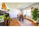 Cozy dining room featuring a wooden table and chairs, with ample natural light from the nearby window at 619 Red Mulberry Rd, Moncks Corner, SC 29461