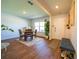Bright dining area with a wooden table, four chairs, and a view of the entry door and foyer at 619 Red Mulberry Rd, Moncks Corner, SC 29461