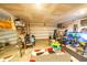 Functional garage with storage racks, exercise equipment, and organization for various household items at 619 Red Mulberry Rd, Moncks Corner, SC 29461