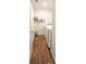 Laundry room with wood look floors and stacked washer and dryer at 619 Red Mulberry Rd, Moncks Corner, SC 29461