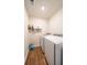 Laundry room with washer, dryer, and shelf storage at 619 Red Mulberry Rd, Moncks Corner, SC 29461
