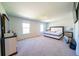 Spacious main bedroom with carpet flooring, natural light, and neutral color palette at 619 Red Mulberry Rd, Moncks Corner, SC 29461