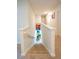 Carpeted staircase with white banister leading to a lower level at 619 Red Mulberry Rd, Moncks Corner, SC 29461