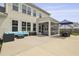 Expansive backyard featuring an outdoor seating area, dining space, and a covered patio for relaxation at 626 Chigwell Springs Ln, Summerville, SC 29486