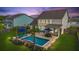 Aerial view of the home, highlighting the backyard pool, patio, and lush greenery at 626 Chigwell Springs Ln, Summerville, SC 29486
