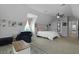 Bright bedroom featuring a comfortable bed, chair and stylish decor at 626 Chigwell Springs Ln, Summerville, SC 29486