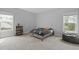 Cozy bedroom with rustic wood furniture, plush carpet, and sunlit windows, creating a serene atmosphere at 626 Chigwell Springs Ln, Summerville, SC 29486