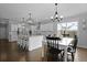 Bright dining room next to the kitchen features ample seating, natural light, and white cabinetry at 626 Chigwell Springs Ln, Summerville, SC 29486