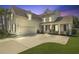 Inviting exterior showcasing a spacious driveway, attached garage, and covered front porch at 626 Chigwell Springs Ln, Summerville, SC 29486