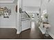 Inviting hallway with hardwood floors, staircase, stylish console table, and natural light at 626 Chigwell Springs Ln, Summerville, SC 29486