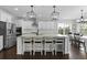Open kitchen with a large island, stainless steel appliances, and white cabinetry at 626 Chigwell Springs Ln, Summerville, SC 29486