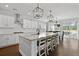 Bright, open-concept kitchen with stainless steel appliances and a view of the dining area at 626 Chigwell Springs Ln, Summerville, SC 29486