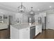 Open-concept kitchen with a large island and stainless-steel appliances at 626 Chigwell Springs Ln, Summerville, SC 29486