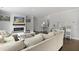 Bright living room featuring a fireplace, dark wood floors, comfortable sectional sofa, and open access to other rooms at 626 Chigwell Springs Ln, Summerville, SC 29486