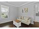 Cozy living room featuring hardwood floors, a neutral color scheme, and natural light at 626 Chigwell Springs Ln, Summerville, SC 29486