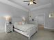 Relaxing main bedroom features a large bed, bedside tables, and neutral decor at 626 Chigwell Springs Ln, Summerville, SC 29486