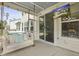 Covered patio featuring a comfortable swing, perfect for relaxing or watching TV, with direct access to the house at 626 Chigwell Springs Ln, Summerville, SC 29486