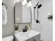 Stylish bathroom features a black rain shower head, sleek fixtures, and tile walls at 6305 Lucille Dr, North Charleston, SC 29406
