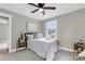 Cozy bedroom features soft grey walls, ceiling fan, and natural light from the window at 6305 Lucille Dr, North Charleston, SC 29406