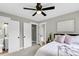 Cozy bedroom featuring a comfortable bed, soft lighting, and adjacent bathroom and closet doors at 6305 Lucille Dr, North Charleston, SC 29406