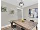 Modern dining room features a wood table, contemporary light fixture, and stylish wall art at 6305 Lucille Dr, North Charleston, SC 29406