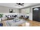 Stylish living room featuring modern decor, a ceiling fan, and wainscoting for a contemporary feel at 6305 Lucille Dr, North Charleston, SC 29406