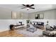 Inviting living room featuring modern décor, including stylish seating and a striking horse painting at 6305 Lucille Dr, North Charleston, SC 29406
