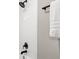A renovated shower with white tiles and matte black hardware at 6305 Lucille Dr, North Charleston, SC 29406