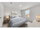 Serene bedroom with a large window, plush carpet, and soothing neutral tones at 725 Meadowbrook Ln, Summerville, SC 29486