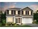 Charming two-story home featuring a two-car garage, classic design, and attractive curb appeal at 725 Meadowbrook Ln, Summerville, SC 29486