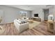 Bright living room with comfortable seating, a stylish rug, and large windows offering great light at 725 Meadowbrook Ln, Summerville, SC 29486