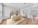Bright home office space with desk, bookshelves, wood floors, and an elegant decorative mirror at 725 Meadowbrook Ln, Summerville, SC 29486