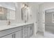Modern bathroom with double sink vanity, white counters, modern faucets and lighting at 735 Maynard Ln, Summerville, SC 29486