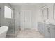 Modern bathroom featuring a glass shower, double sink vanity, and marble tile floors at 735 Maynard Ln, Summerville, SC 29486