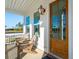 Inviting front porch with comfortable seating and a view of the surrounding landscape at 735 Maynard Ln, Summerville, SC 29486