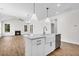Well-lit kitchen with center island and views of the fireplace at 735 Maynard Ln, Summerville, SC 29486