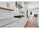 Kitchen featuring white cabinets, subway tile backsplash, modern appliances, and wood floors at 735 Maynard Ln, Summerville, SC 29486