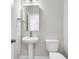 Powder room featuring pedestal sink, toilet and decorative mirror and lighting at 735 Maynard Ln, Summerville, SC 29486