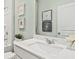 Clean, well-lit bathroom with a white vanity, stylish decor, and modern fixtures at 753 Meadowbrook Ln, Summerville, SC 29486