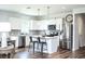 Bright kitchen featuring white cabinets, stainless steel appliances, an island and dark wood flooring at 753 Meadowbrook Ln, Summerville, SC 29486