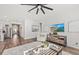 Bright and airy living room with hardwood floors, modern furniture, a ceiling fan, and stylish decor at 753 Meadowbrook Ln, Summerville, SC 29486