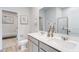 Stylish bathroom featuring double sinks, quartz counters, and a glass-enclosed shower at 755 Meadowbrook Ln, Summerville, SC 29486