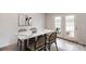 Elegant dining area with a marble table and a view of outdoor seating at 755 Meadowbrook Ln, Summerville, SC 29486