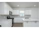 Modern kitchen with stainless steel appliances, white cabinetry, and an island at 755 Meadowbrook Ln, Summerville, SC 29486