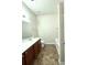 Bathroom features a single sink vanity, toilet, and tub with tiled floor at 7629 High Maple Cir, North Charleston, SC 29418