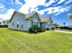 Side view of home, showcasing the well-maintained lawn and neighborhood setting at 7629 High Maple Cir, North Charleston, SC 29418