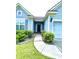 Front entrance featuring a walkway to the dark front door at 7629 High Maple Cir, North Charleston, SC 29418